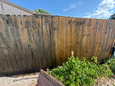 Polynesian Isles, Gulf Breeze — wood privacy fence mid-clean