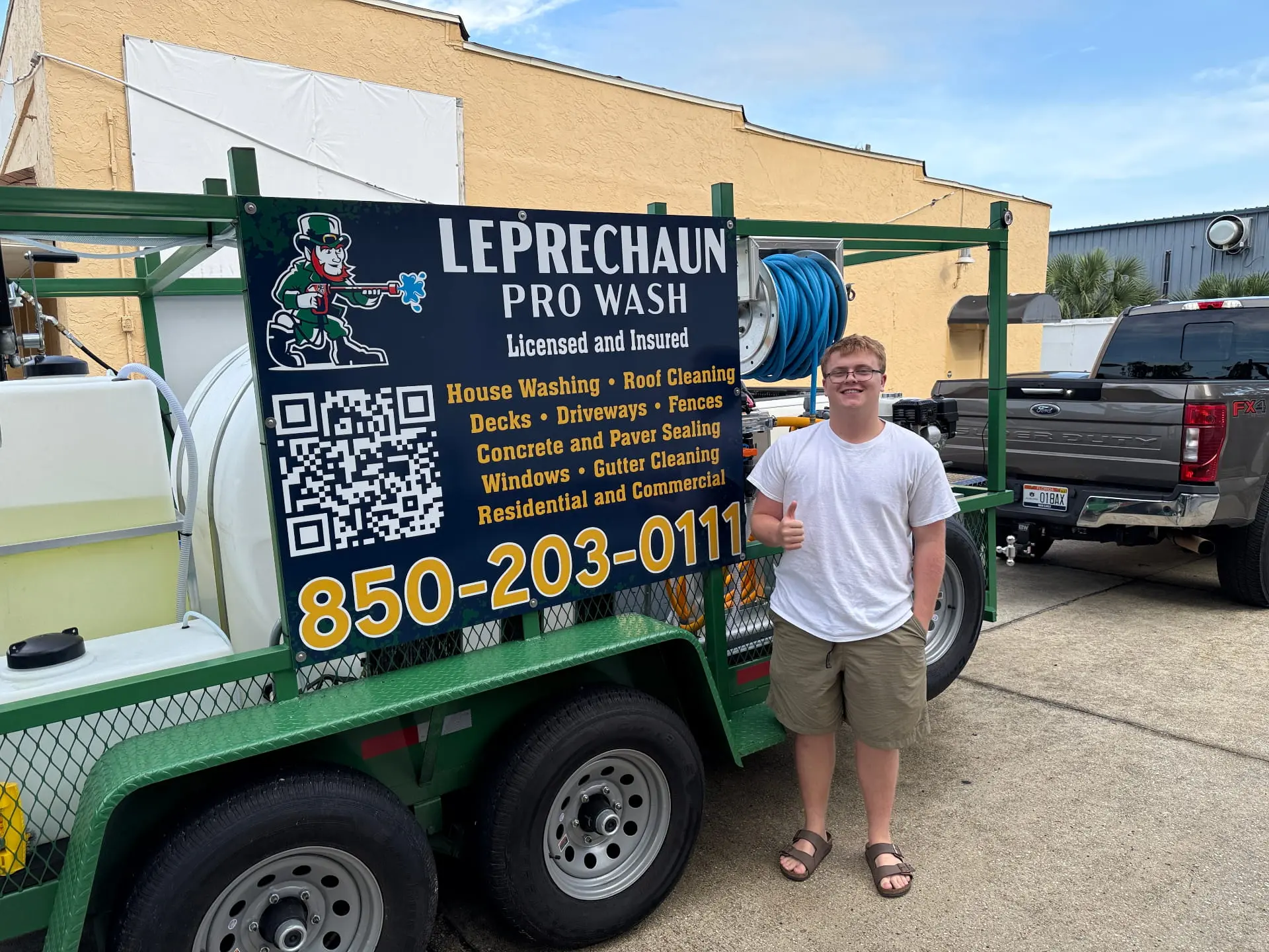 Leprechaun Pro Wash owner standing beside company trailer in Gulf Breeze, Florida